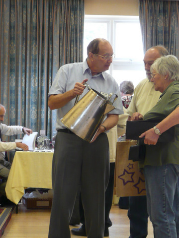 Nigel showing the huge Garage Jug to Diana